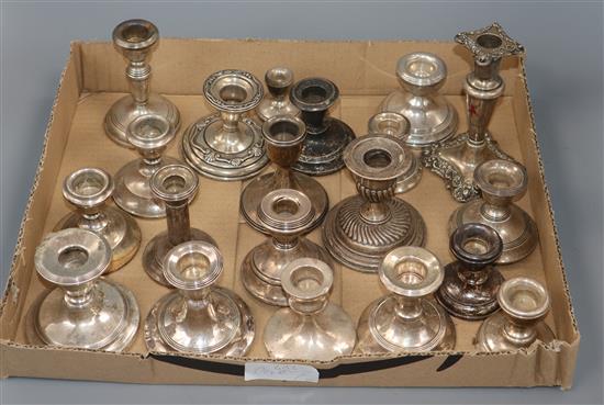 Twenty assorted early 20th century and later silver dwarf candlesticks,